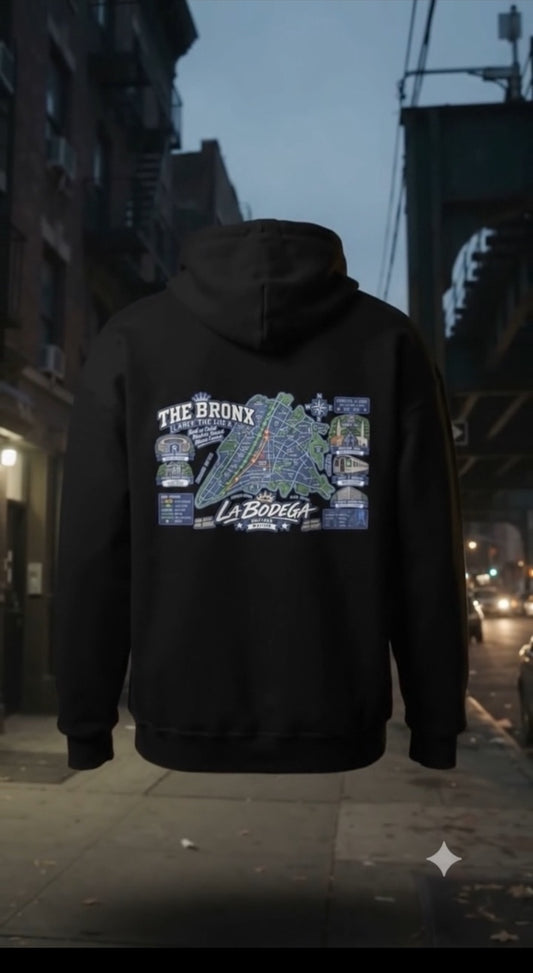 The Bronx Map Hoodie shown from the back on a nighttime Bronx street